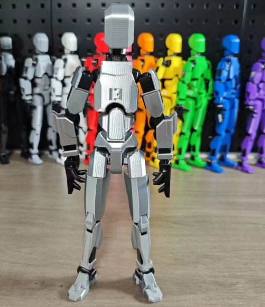 Orange 3D-printad robotfigur i pose